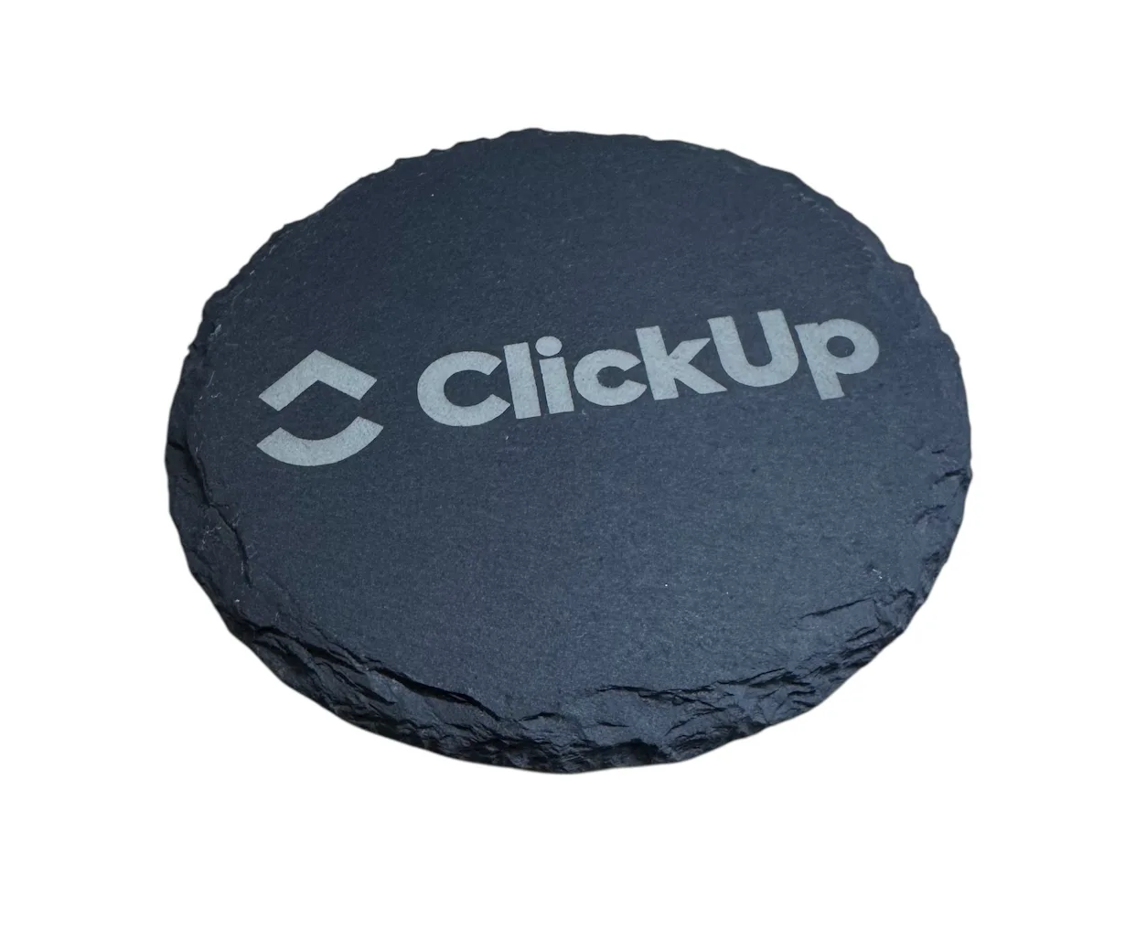 Round black stone branded with the ClickUp name